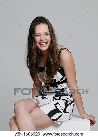 Stock Image - Studio shot of teen girl. Fotosearch