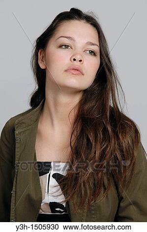 Stock Image - Studio shot of teen girl. Fotosearch
