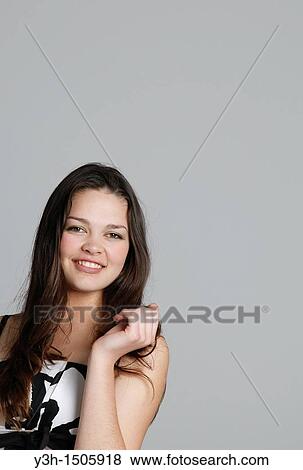 Studio shot of teen girl View Large Photo Image Stock Photo - Studio shot of teen girl. Fotosearch