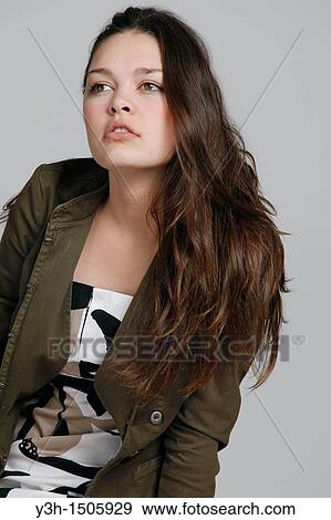 Stock Photo - Studio shot of teen girl. Fotosearch