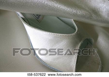 Stock Image - Studio shot of white dancing shoe.. Fotosearch