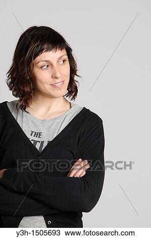 Studio shot of woman, arms crossed View Large Photo Image Stock Image - Studio shot of woman, arms crossed. Fotosearch
