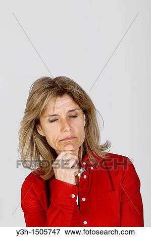 Stock Photo - Studio shot of woman, eyes closed. Fotosearch