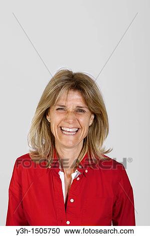 Studio shot of woman, laughing View Large Photo Image Stock Image - Studio shot of woman, laughing. Fotosearch