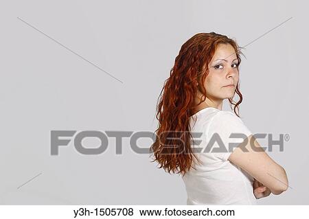 Stock Photo - Studio shot of woman, looking at camera. Fotosearch