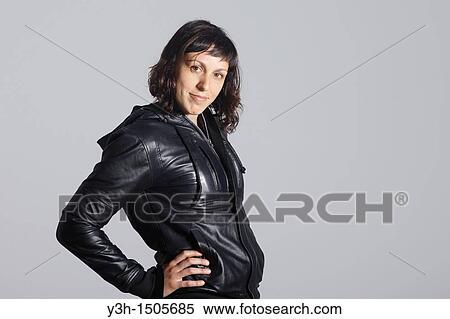 Studio shot of woman, looking at camera View Large Photo Image Stock Photography - Studio shot of woman, looking at camera. Fotosearch