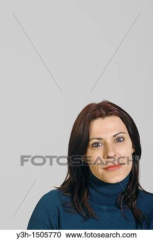Stock Image - Studio shot of woman, portrait. Fotosearch