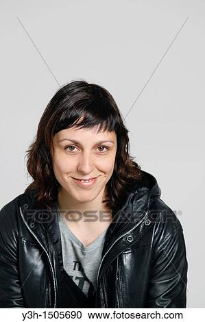 Studio shot of woman, smiling View Large Photo Image Stock Image - Studio shot of woman, smiling. Fotosearch