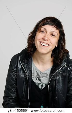 Studio shot of woman, smiling View Large Photo Image Stock Image - Studio shot of woman, smiling. Fotosearch