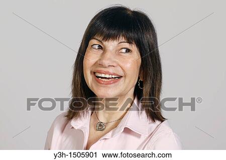 Studio shot of woman, smiling View Large Photo Image Stock Image - Studio shot of woman, smiling. Fotosearch