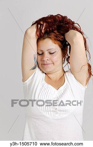 Stock Image - Studio shot of woman. Fotosearch
