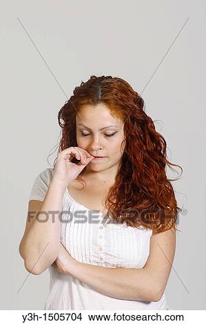 Studio shot of woman, thoughtful View Large Photo Image Picture - Studio shot of woman, thoughtful. Fotosearch