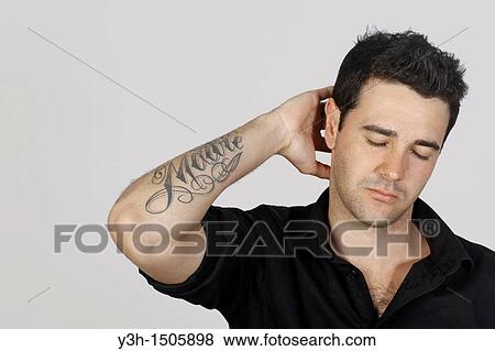 Studio shot of young Brazilian man, thoughtful View Large Photo Image Stock Photo - Studio shot of young Brazilian man, thoughtful. Fotosearch