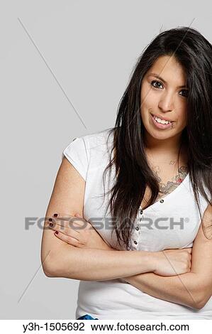 Studio shot of young Chilean woman, arms crossed View Large Photo Image Stock Image - Studio shot of young Chilean woman, arms crossed. Fotosearch