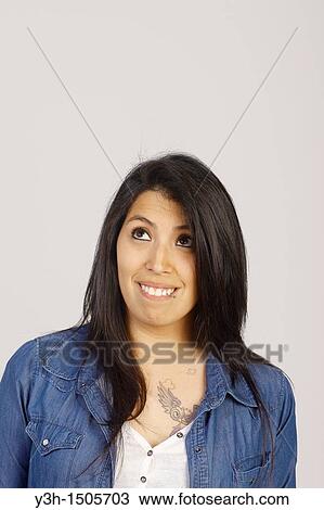 Studio shot of young Chilean woman, looking upwards View Large Photo Image Stock Image - Studio shot of young Chilean woman, looking upwards. Fotosearch