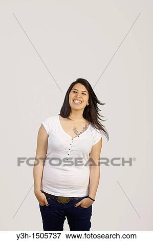 Stock Photo - Studio shot of young Chilean woman, laughing. Fotosearch