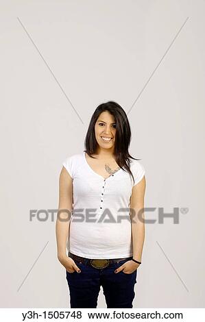 Stock Photo - Studio shot of young Chilean woman, smiling. Fotosearch