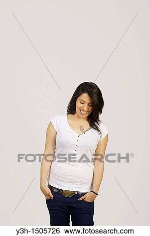 Stock Photograph - Studio shot of young Chilean woman, laughing. Fotosearch