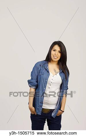 Stock Photography - Studio shot of young Chilean woman, smiling. Fotosearch