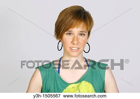Studio shot of young girl, looking at camera View Large Photo Image Stock Photo - Studio shot of young girl, looking at camera. Fotosearch