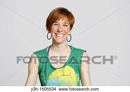 Studio shot of young girl, smiling View Large Photo Image Picture - Studio shot of young girl, smiling. Fotosearch