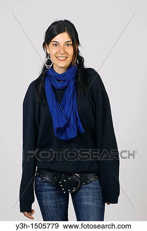 Stock Photo - Studio shot of young girl, smiling. Fotosearch