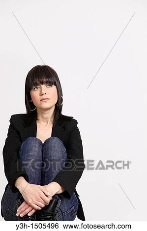 Studio shot of young Italian woman, thoughtful View Large Photo Image Stock Photograph - Studio shot of young Italian woman, thoughtful. Fotosearch