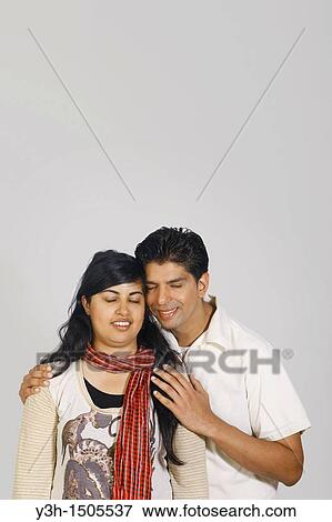 Studio shot of young pakistani couple View Large Photo Image Stock Photo - Studio shot of young pakistani couple. Fotosearch