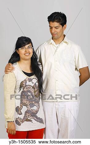 Studio shot of young pakistani couple View Large Photo Image Stock Photography - Studio shot of young pakistani couple. Fotosearch