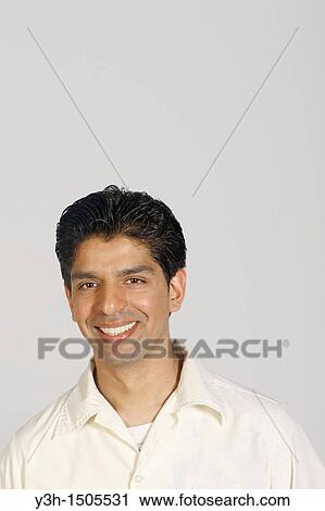 Studio shot of young pakistani man, smiling View Large Photo Image Stock Image - Studio shot of young pakistani man, smiling. Fotosearch