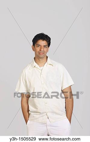 Stock Photo - Studio shot of young pakistani man. Fotosearch