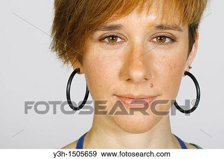 Stock Photo - Studio shot of young woman, close up. Fotosearch