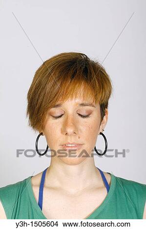 Studio shot of young woman, closed eyes View Large Photo Image Picture - Studio shot of young woman, closed eyes. Fotosearch