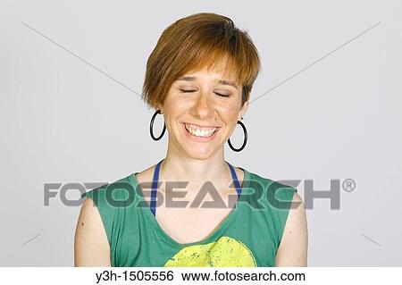 Studio shot of young woman, closed eyes View Large Photo Image Stock Photograph - Studio shot of young woman, closed eyes. Fotosearch