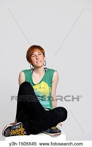 Studio shot of young woman, closed eyes View Large Photo Image Stock Photography - Studio shot of young woman, closed eyes. Fotosearch