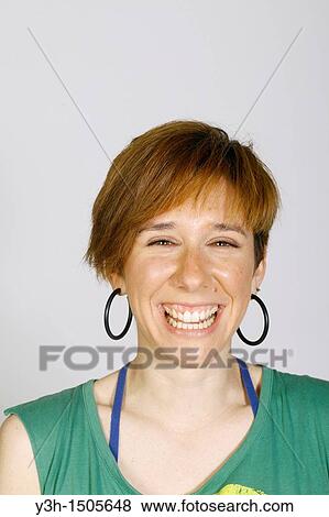 Studio shot of young woman, laughing View Large Photo Image Stock Photo - Studio shot of young woman, laughing. Fotosearch