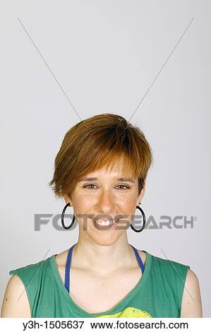Studio shot of young woman, looking at camera View Large Photo Image Stock Photo - Studio shot of young woman, looking at camera. Fotosearch