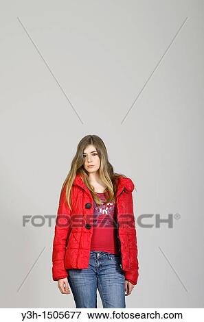 Studio shot of young woman, serious View Large Photo Image Stock Photo - Studio shot of young woman, serious. Fotosearch
