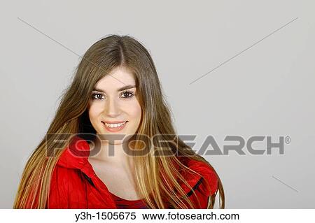 Studio shot of young woman, smiling View Large Photo Image Stock Photography - Studio shot of young woman, smiling. Fotosearch