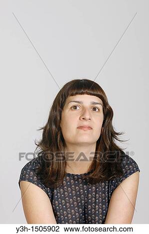Stock Image - Studio shot of young woman. Fotosearch