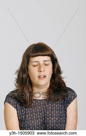 Stock Image - Studio shot of young woman. Fotosearch