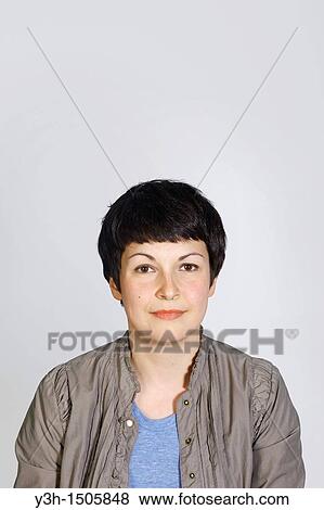 Studio shot of young woman View Large Photo Image Stock Photo - Studio shot of young woman. Fotosearch