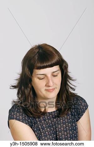 Stock Photo - Studio shot of young woman. Fotosearch