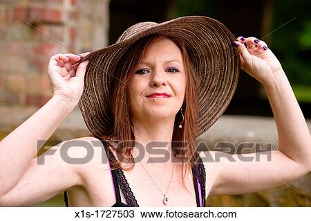Stock Image - Stylish, elegant American woman outdoors. Fotosearch