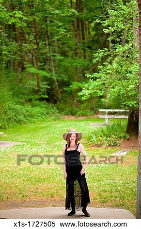 Stylish, elegant American woman outdoors View Large Photo Image Stock Photography - Stylish, elegant American woman outdoors. Fotosearch