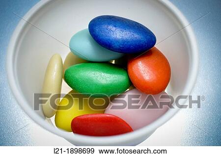 Sugared colors in a white plastic container. View Large Photo Image Stock Photo - Sugared colors in a white plastic container.. Fotosearch