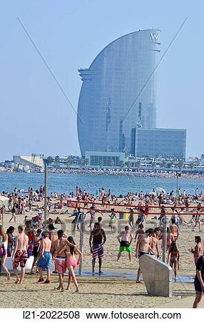 Summer. People at the beach. Barceloneta beach and Hotel Vela by Ricard Bofill. Barcelona, Catalonia, Spain. View Large Photo Image Stock Photo - Summer. People at the beach. Barceloneta beach and Hotel Vela by Ricard Bofill. Barcelona, Catalonia, Spain.. Fotosearch