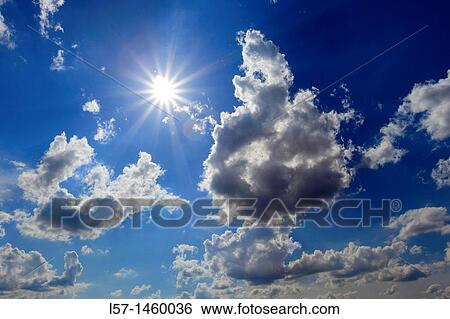 Sun and clouds in blue sky, Switzerland View Large Photo Image Stock Photograph - Sun and clouds in blue sky, Switzerland. Fotosearch
