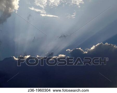 Sun-rays over Germany Bavarian sunset sky. View Large Photo Image Picture - Sun-rays over Germany Bavarian sunset sky.. Fotosearch