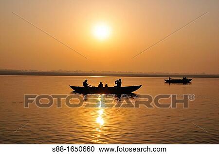 Sun rise from over the Ganges View Large Photo Image Stock Image - Sun rise from over the Ganges. Fotosearch